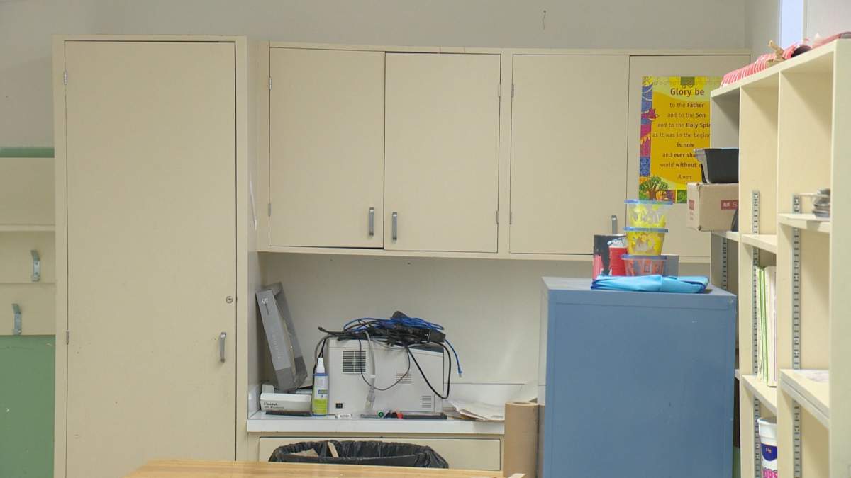 Now slanted cupboards in a closed Ecole St. Pius classroom.