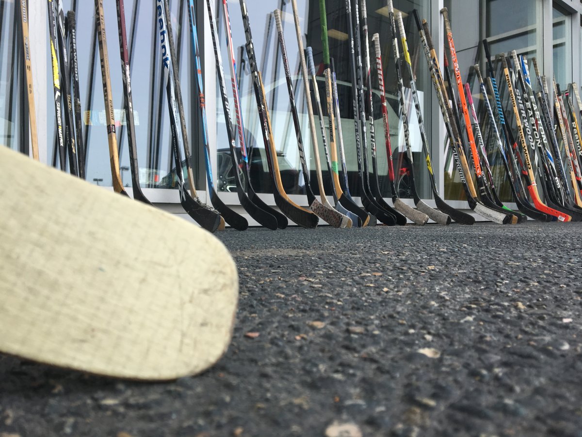Hundreds of donated hockey sticks help Humboldt fundraiser.