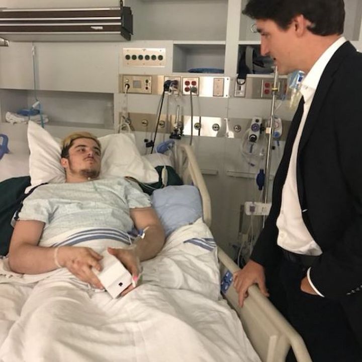 Prime Minister Justin Trudeau speaks with Humboldt Broncos crash survivor Ryan Straschnitzki in hospital on April 8, 2018.