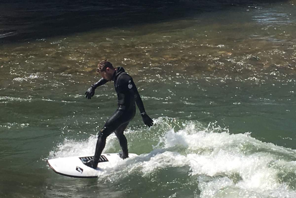 A river surfer enjoying the wave at 10 Street in Calgary on Friday, April 27, 2018.