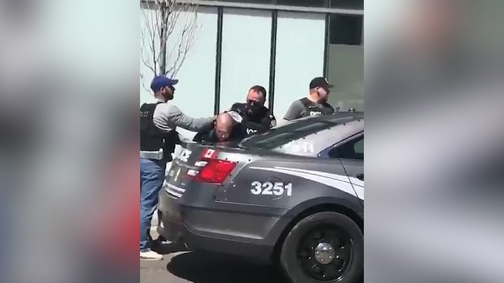Toronto police are seen arresting Alek Minassian Monday afternoon.