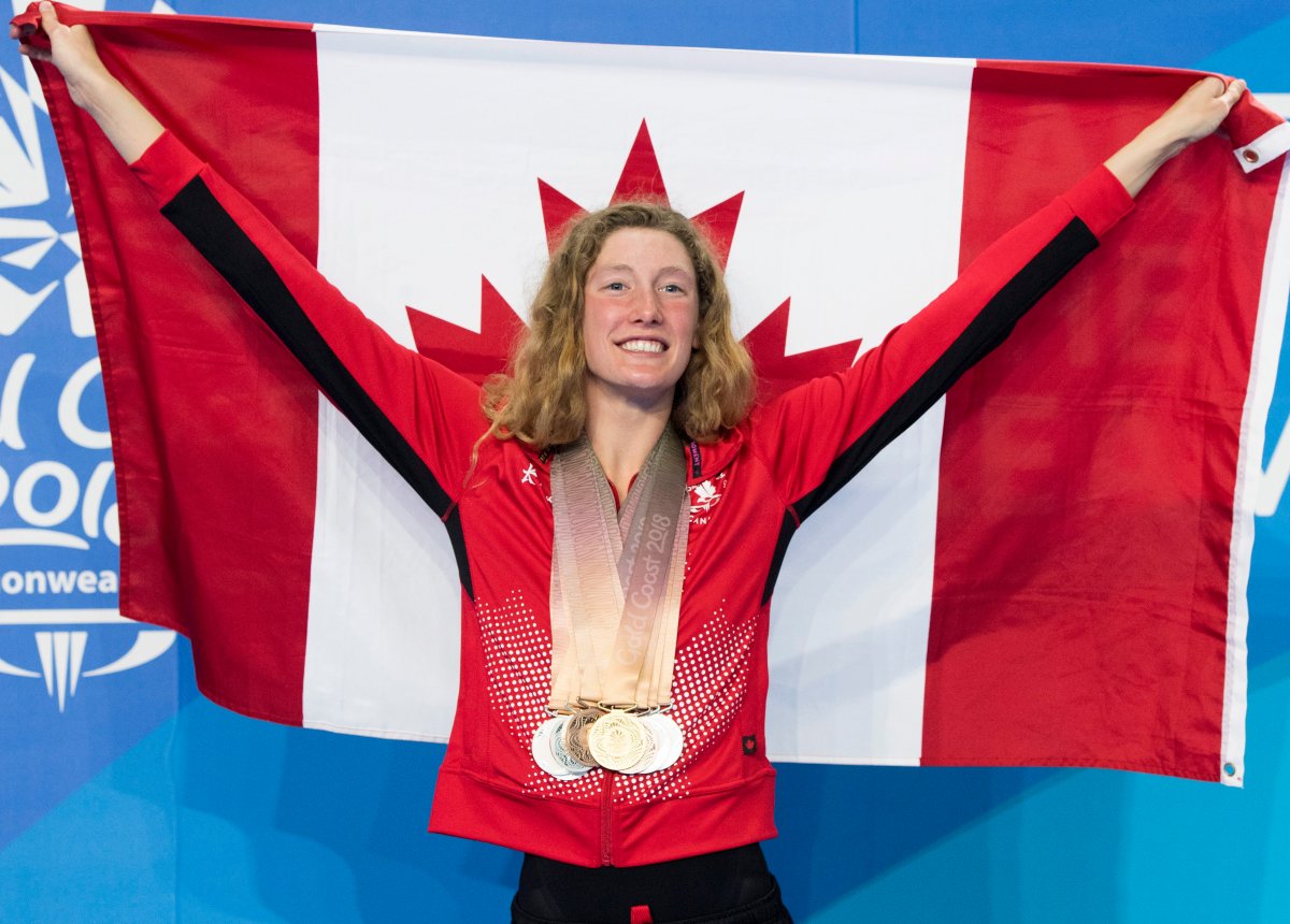 Canada's Taylor Ruck poses for photos with her eight swimming medals at the Commonwealth Games Tuesday, April 10, 2018  in Gold Coast, Australia.THE CANADIAN PRESS/Ryan Remiorz.