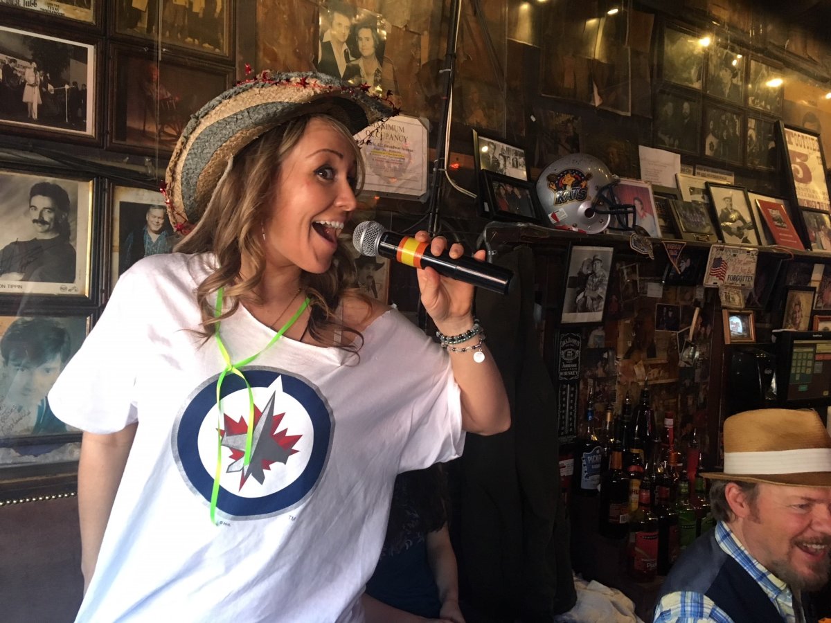 Winnipeg-born singer Courtney Lynn belts out 'O Canada' at Tootsies bar in Nashville Sunday. 