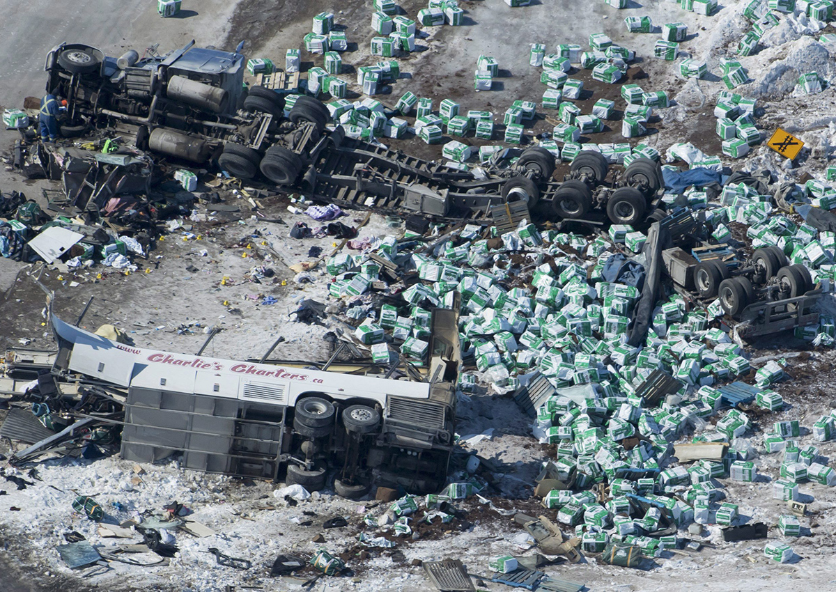 The wreckage of a fatal crash outside of Tisdale, Sask., is seen Saturday, April, 7, 2018. A bus carrying the Humboldt Broncos hockey team crashed into a truck en route to Nipawin for a game Friday night killing 14 and sending over a dozen more to the hospital. THE CANADIAN PRESS/Jonathan Hayward