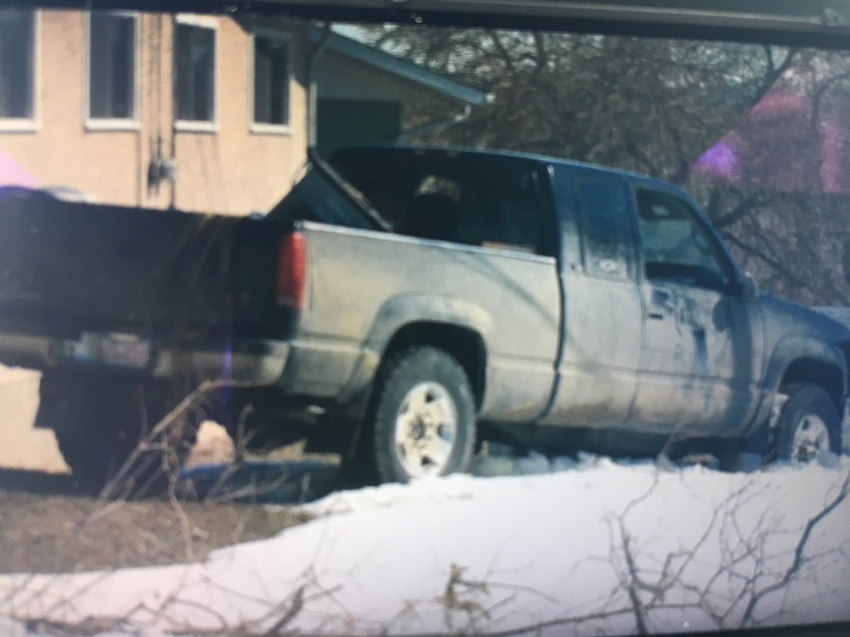 Calgary police have arrested a suspect after a truck smashed into a home in northwest Calgary on April 9, 2018.
