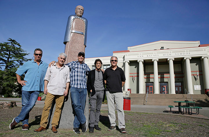 In this Friday, April 13, 2018 photo, the Waldos pose below a statue of Louis Pasteur at San Rafael High School in San Rafael, Calif.
