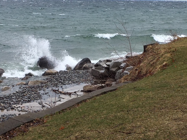 Waves crashing against the shore in front of Murney Tower in Kingston. 
