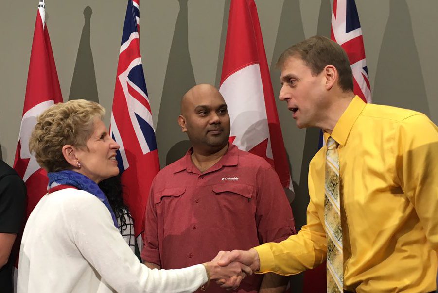 Premier Kathleen Wynne greets Info-Tech Research Group employees during a stop in London, including account management senior director, Vince Londini.