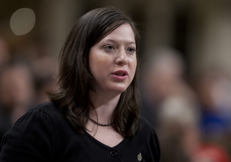 NDP MP Christine Moore rises during Question Period in the House of Commons in early 2012. 