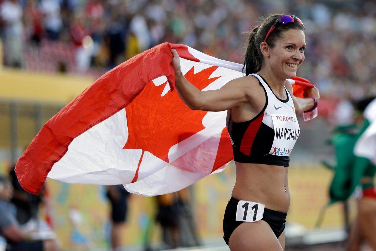 Canada's Lanni Marchant celebrates after winning the bronze medal in the women's 10,000 meter run at the Pan Am Games in Toronto, Thursday, July 23, 2015. (AP Photo/Mark Humphrey).