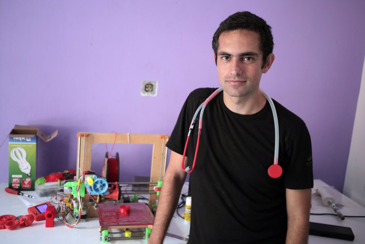 FILE - In this Monday, Sept. 7, 2015 photo, Dr. Tarek Loubani, a Palestinian-Canadian doctor, poses for a picture with 3D printed stethoscope around his neck, in Gaza City.