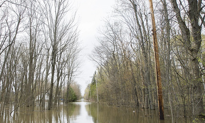 In this file photo, a road surrounded by floodwaters is shown. 