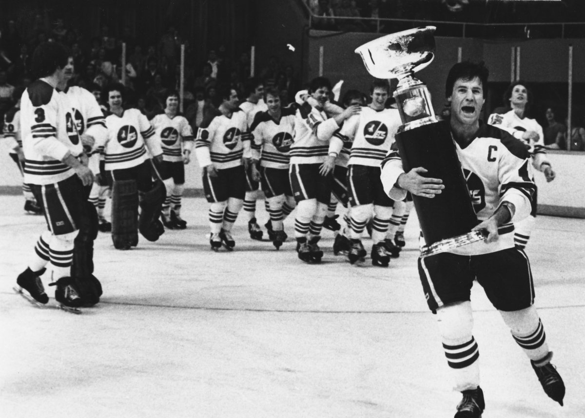 Winnipeg Jets captain Lars-Erik Sjoberg carries the Avco Cup after the Jets beat the Edmonton Oilers 7-3 to capture the final WHA championship four games to two in Winnipeg, May 20, 1979.