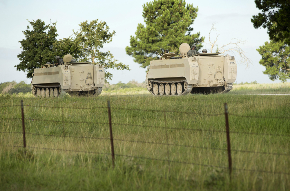 A convoy of National Guard troops moves on Camp Swift, which is also hosting the Operation Jade Helm 15 military exercise, in Bastrop, Texas, on Wednesday July 15, 2015.  