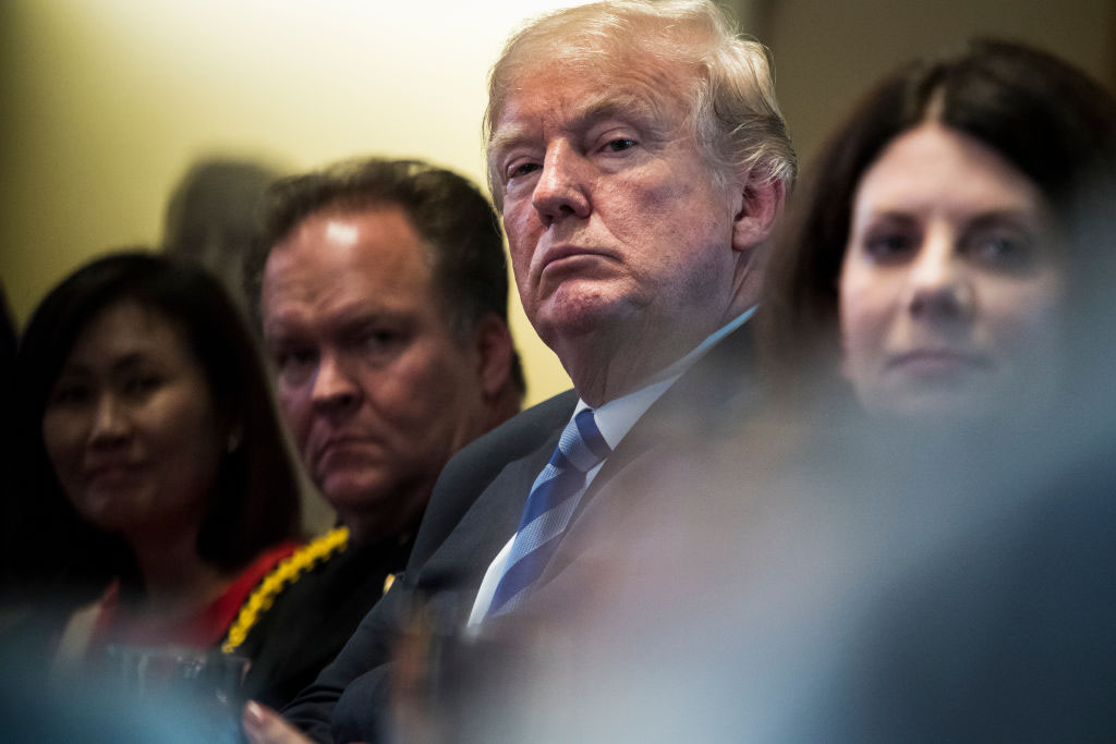 U.S. President Donald J. Trump listens during a meeting with California leaders and public officials who oppose California's sanctuary policies May 16, 2018, in Washington, D.C. 