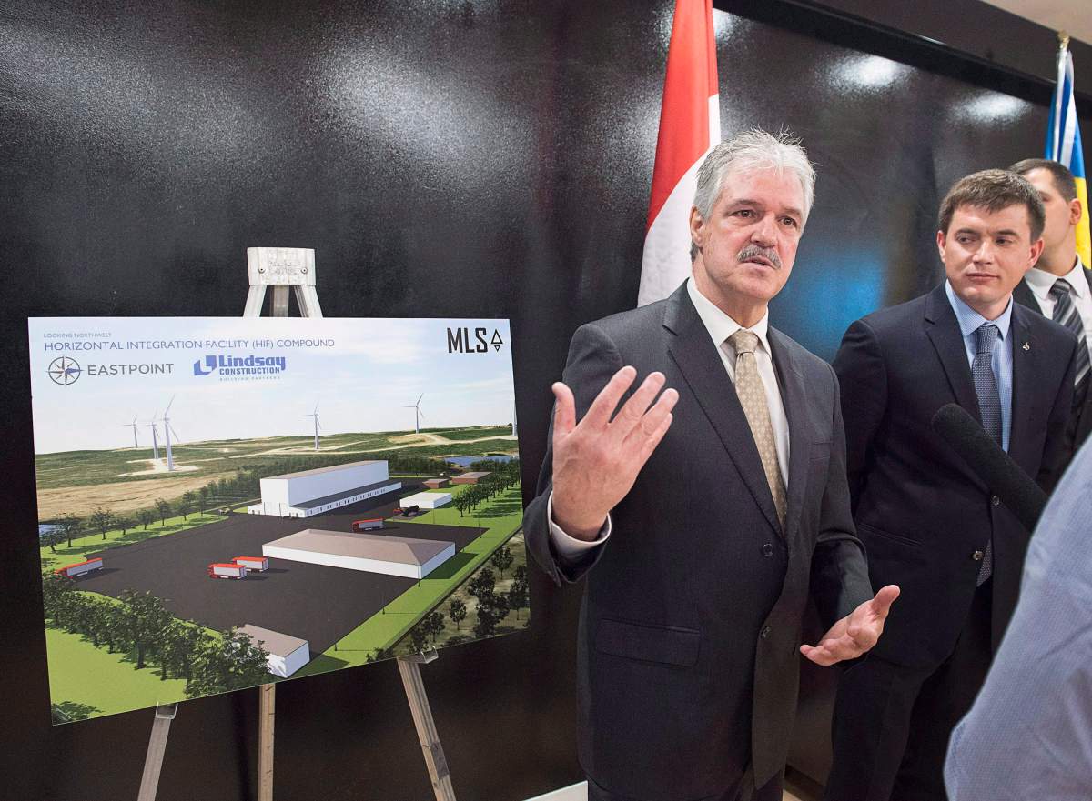 FILE - Stephen Matier, left, president of Maritime Launch Services and Maksym Degtiarov, chief designer of the launch vehicle at the Yuzhnoye Design Bureau, talk with reporters at a meeting of the proposed Spaceport project team in Dartmouth, N.S. on Monday, Dec. 11, 2017. 