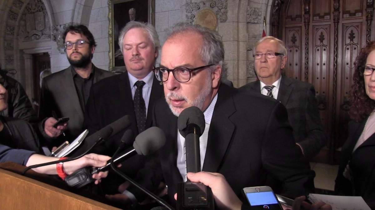 In this framegrab from video, Bloc Quebecois MP Rheal Fortin announces he is quitting the party caucus in Ottawa, Wednesday, Feb.28, 2018. 