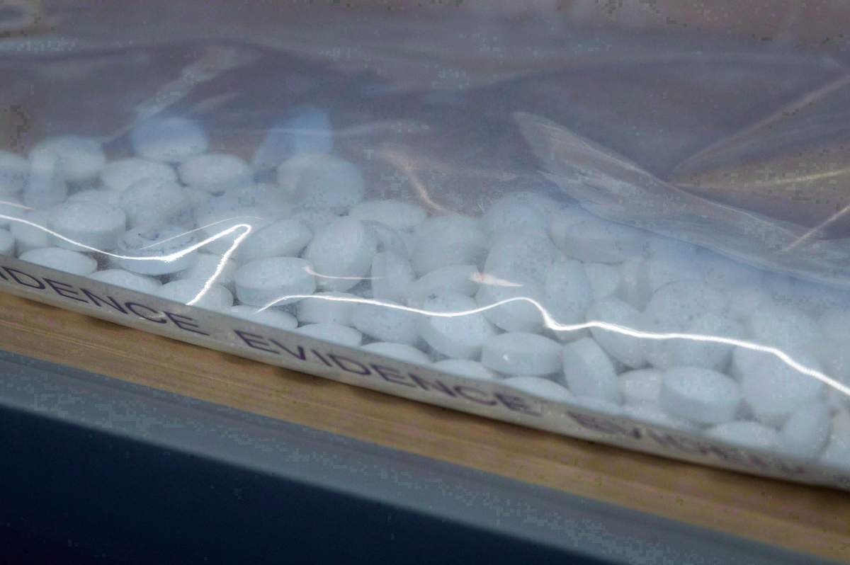 Fake Oxycontin pills containing fentanyl are displayed during a news conference at RCMP headquarters in Surrey, B.C., on Thursday, September 3, 2015.