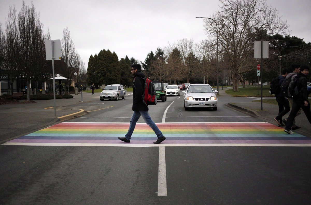 File - Students are seen crossing the Ring Rd. following the announcement of the world's only chair in transgender studies at The University of Victoria in Victoria, B.C., Friday, January 15, 2016.