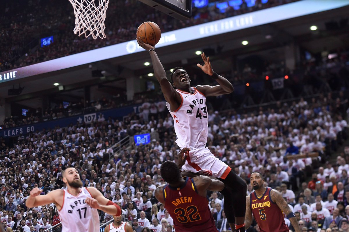 Toronto Raptors forward Pascal Siakam (43) drives to the basket over Cleveland Cavaliers forward Jeff Green (32) as teammate Raptors centre Jonas Valanciunas (17) looks on during first half second round NBA playoff basketball action in Toronto on Tuesday, May 1, 2018. 