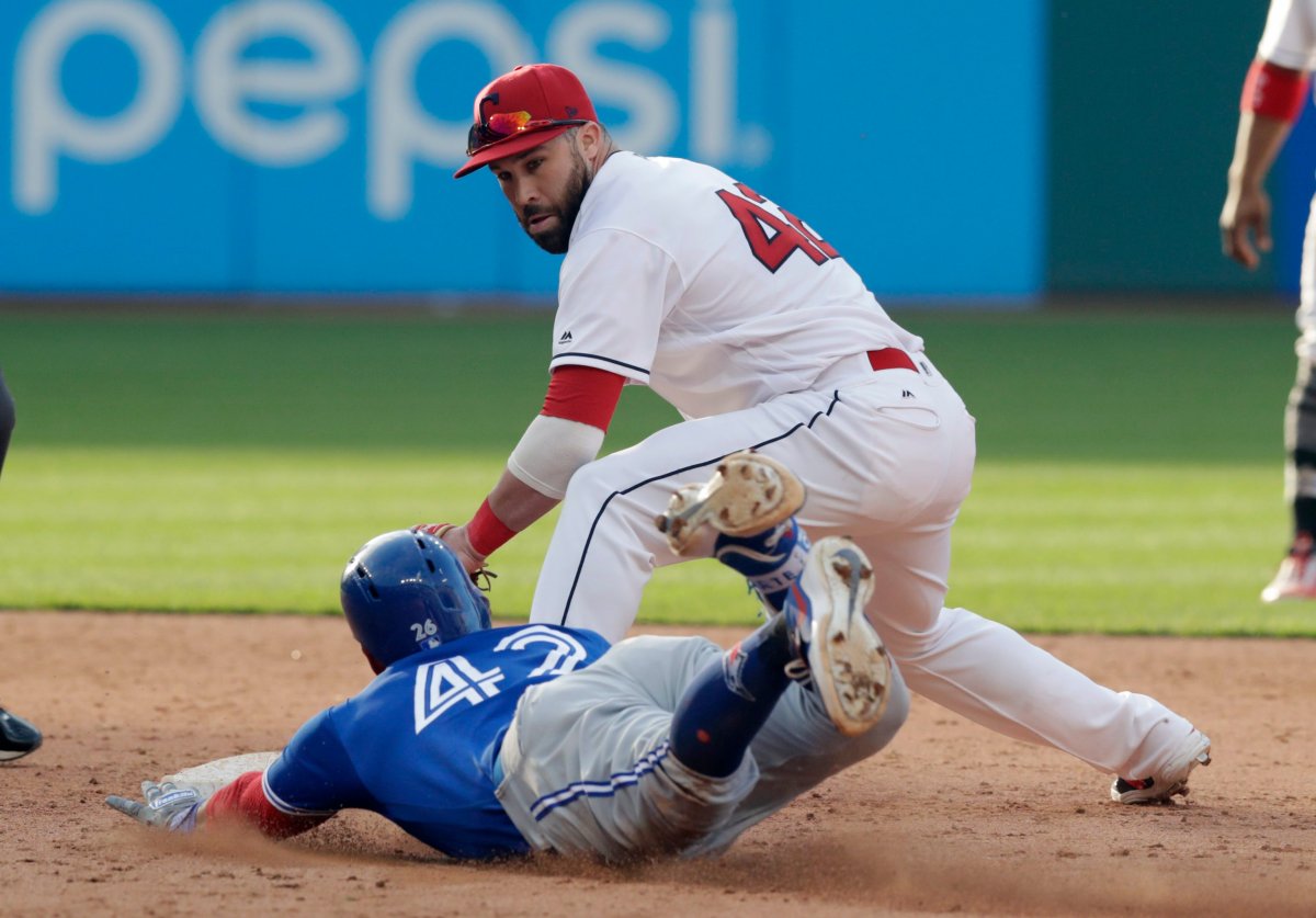 Cleveland Indians' Jason Kipnis tags out Toronto Blue Jays' Yangervis Solarte during the 10th inning in the first game of a baseball doubleheader Thursday, May 3, 2018, in Cleveland. Solarte tried to stretch a single into a double. 
