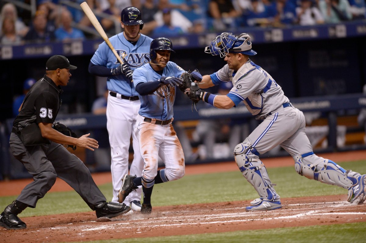 Tampa Bay Rays Mallex Smith (0) is tagged out stealing home by Toronto Blue Jays catcher Luke Maile (21) during the third inning of a baseball game Sunday, May 6, 2018, in St. Petersburg, Fla. 