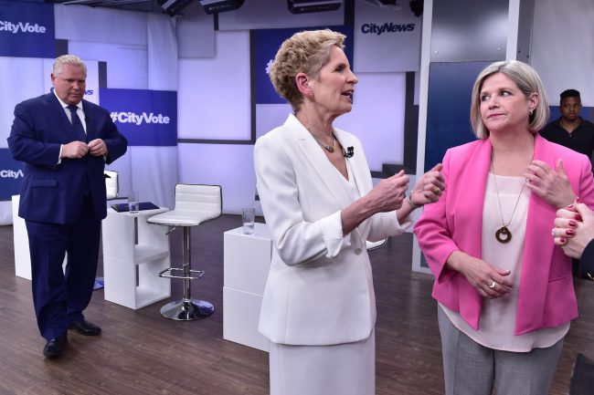 Liberal Premier Kathleen Wynne, centre, Progressive Conservative Leader Doug Ford, left, and NDP Leader Andrea Horwath take part in the Ontario Leaders debate in Toronto on Monday, May 7, 2018. This is the first of three debates scheduled before the June 7 vote.