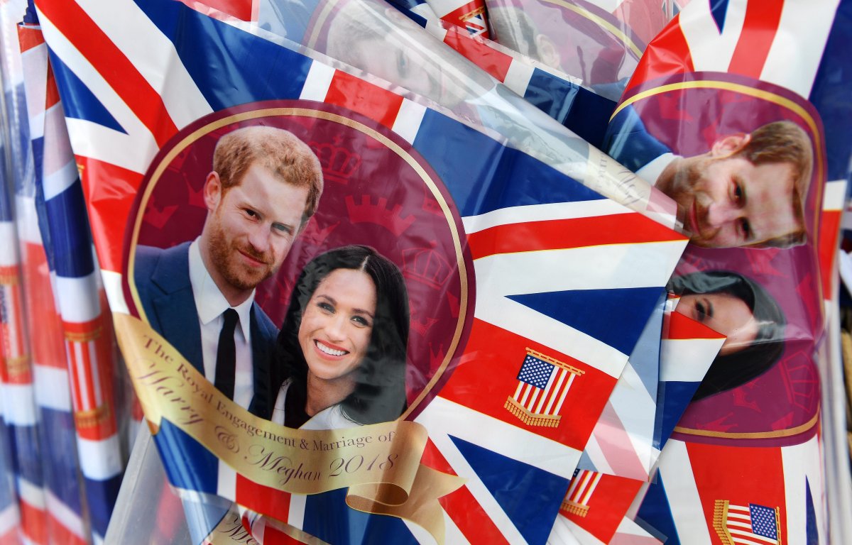 Royal wedding plastic flags with Prince Harry and Meghan Markle on sale at a store in Windsor, Britain. Two Canadians are on their way to the U.K. to wave proverbial flags of their own for the married couple to be.