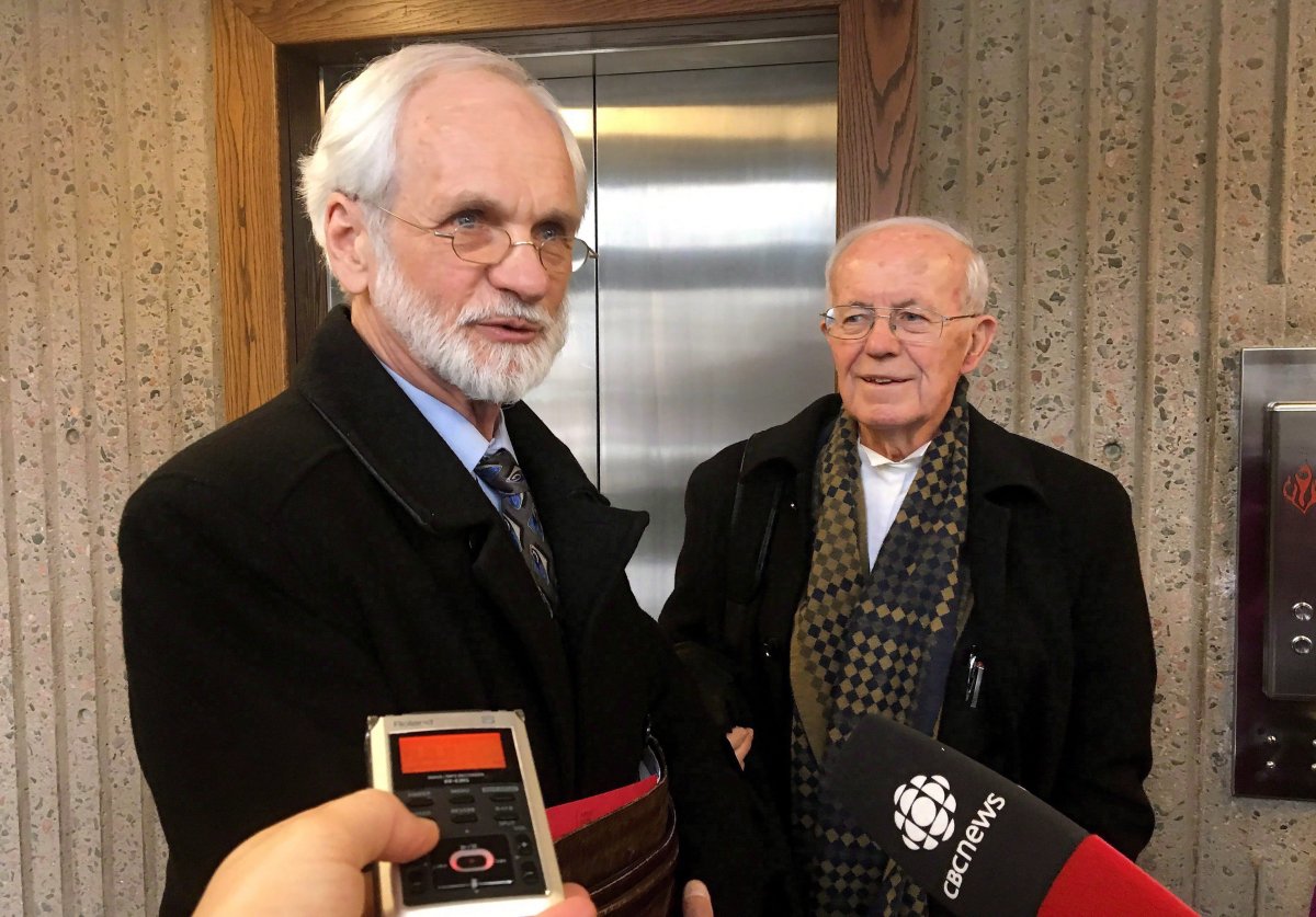 Former Knowledge House Inc. president and CEO Daniel Potter, left, speaks to reporters at the courthouse in Halifax on Friday, March 9, 2018. 
