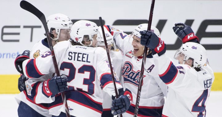 Host Regina Pats forward Nick Henry (21) celebrates his goal over the Swift Current Broncos with his teammates during first period Memorial Cup action in Regina on Wednesday, May, 23, 2018. 