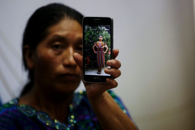 Dominga Vicente, a relative of Claudia Gomez Gonzales, shows a photo of her during a press conference in Guatemala City, Guatemala, May 25, 2018.



