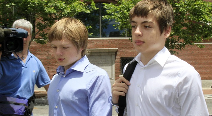 FILE - In this July 1, 2010, file photo, Alex Vavilov, right, and his older brother brother Tim leave a federal court after a bail hearing for their parents Donald Heathfield and Tracey Ann Foley, in Boston, Massachusetts. The now 23-year-old Alex and brother Tim seek the right to reside permanently in Canada, the country where their parents once lived clandestine lives as deeply embedded Russian spies. 