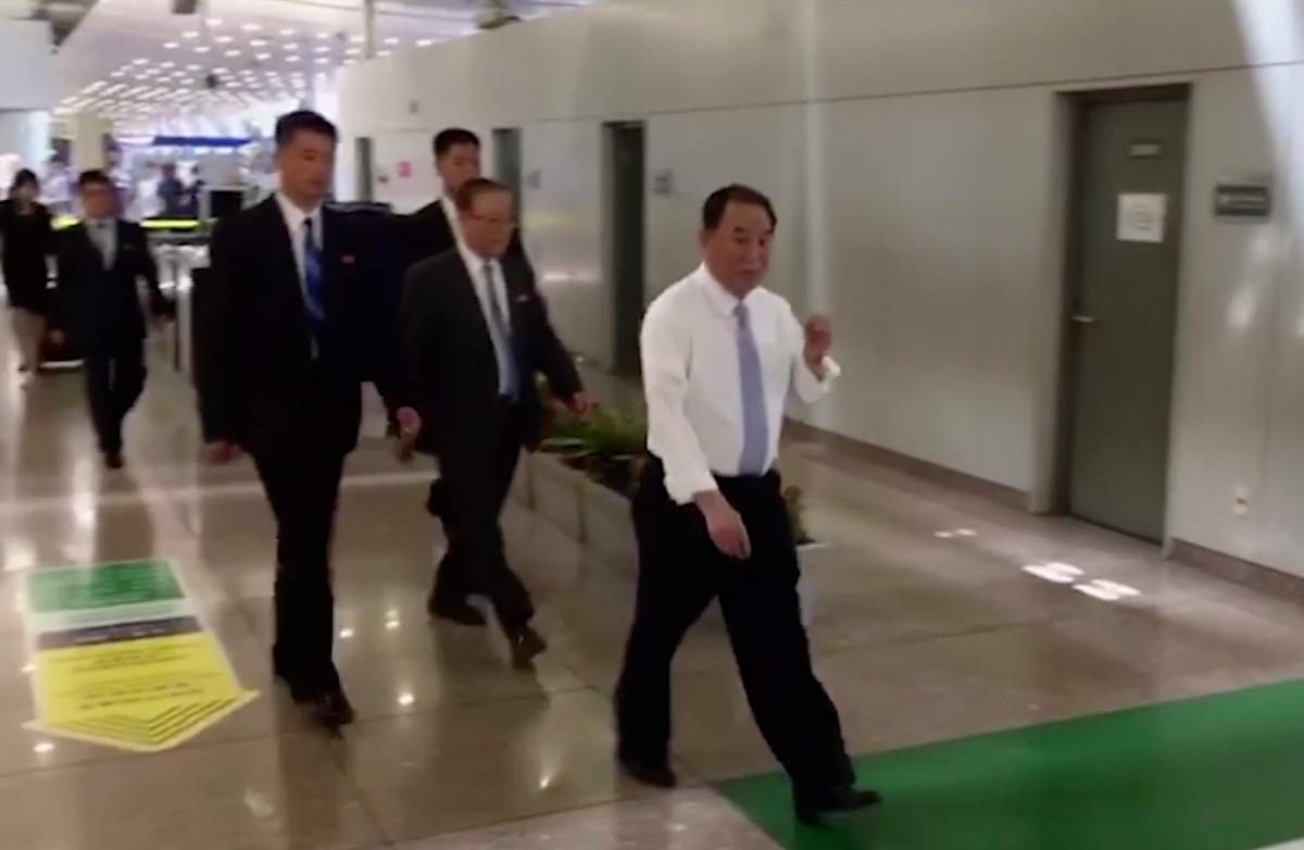 In this image made from video, Kim Yong Chol, in white, a former military intelligence chief who is now Kim Jong Un’s top official on inter-Korean relations, walks upon arrival at Beijing airport in Beijing Tuesday, May 29, 2018.