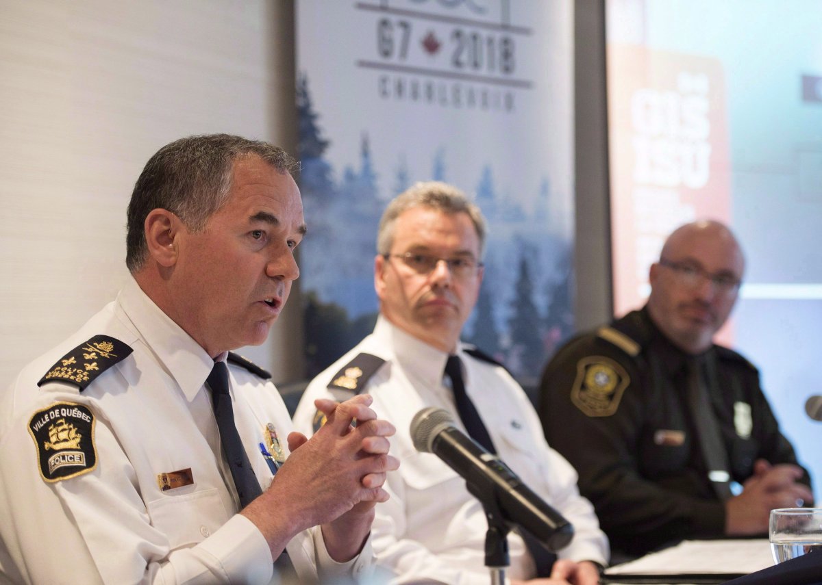 Quebec City police chief Robert Pigeon speaks at a news conference of the joint forces for the G7 Summit, Wednesday, May 16, 2018 in Quebec City. From left, Robert Pigeon, RCMP inspector Christian Cote and Surete du Quebec Lt. Jason Allard, look on. Quebec City Mayor Regis Labeaume says he believes federal dollars will be available for any citizens who suffer property damage during next week's G7 summit. 