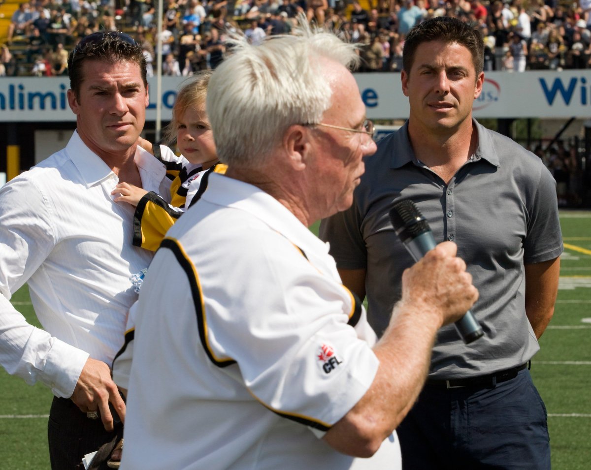 File photo - Retiring Hamilton Tiger-Cats players Rob Hitchcock (left) and Mike Morreale look on as Ron Lancaster speaks during a halftime ceremony honouring them in Hamilton, Ont., Monday Sept. 3, 2007.
