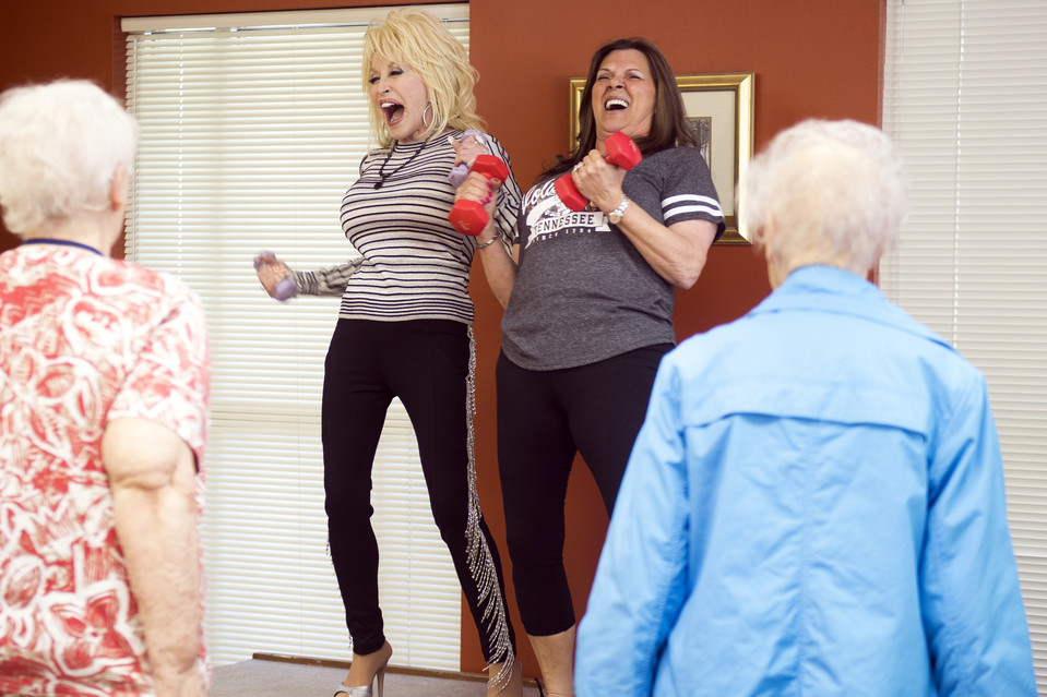Dolly Parton joins in an exercise class at the renamed My People Senior Activity Center in Sevierville, Tenn. on May 7, 2018.