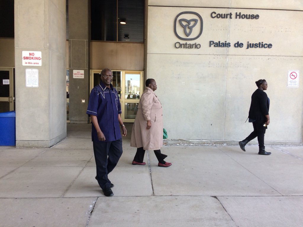 Emmanuel Awai's father, and other family members, leave the courthouse on Wednesday, May 9, 2018. 