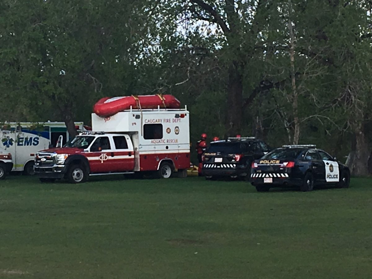 Emergency crews on the scene of a body found in the Elbow River in Calgary on Friday, May 18.