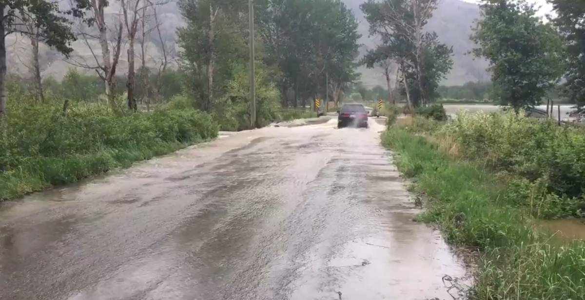 The bridge to the Lower Similkameen Indian Band reserves near Cawston has been covered by flood water. 