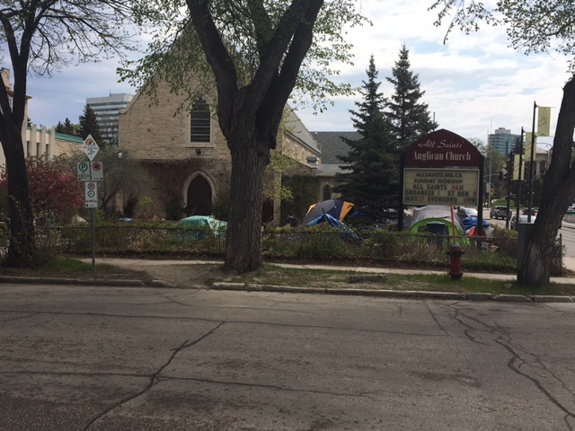 Homeless people have set up about a dozen tents on the green space beside All Saints Anglican Church.