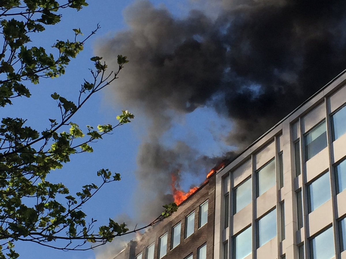 The downtown Montreal building that houses Le Devoir is on fire.