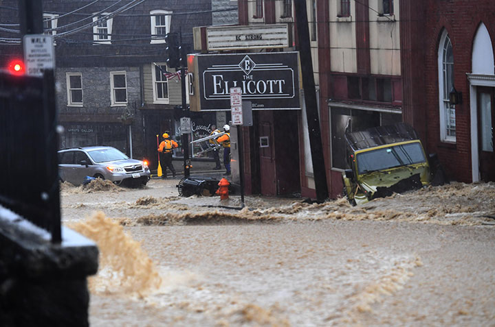Main Street is a raging river during a torrential downpour that lasted hours May 27, 2018 in Ellicott City, MD.