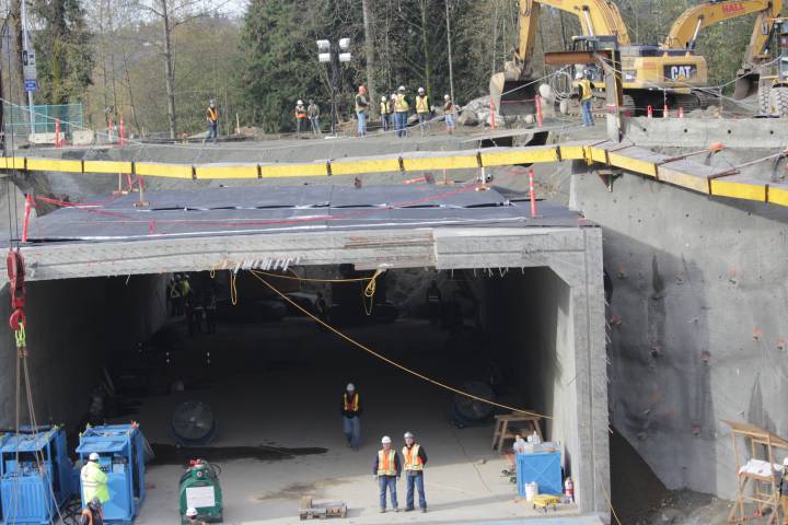 Crews work on TransLink's Evergreen line in 2013. Fears of a land speculation rush during construction of the new SkyTrain to UBC have prompted debate over a partial rezoning freeze along the corridor.