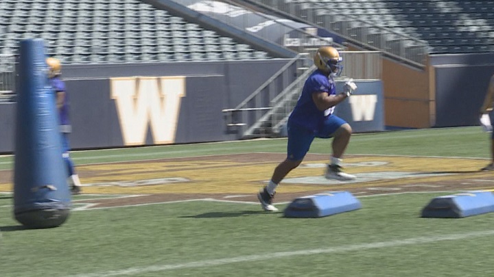 Winnipeg Blue Bombers defensive lineman Faith Ekakitie takes part in individual drills during training camp on Friday at Investors Group Field.