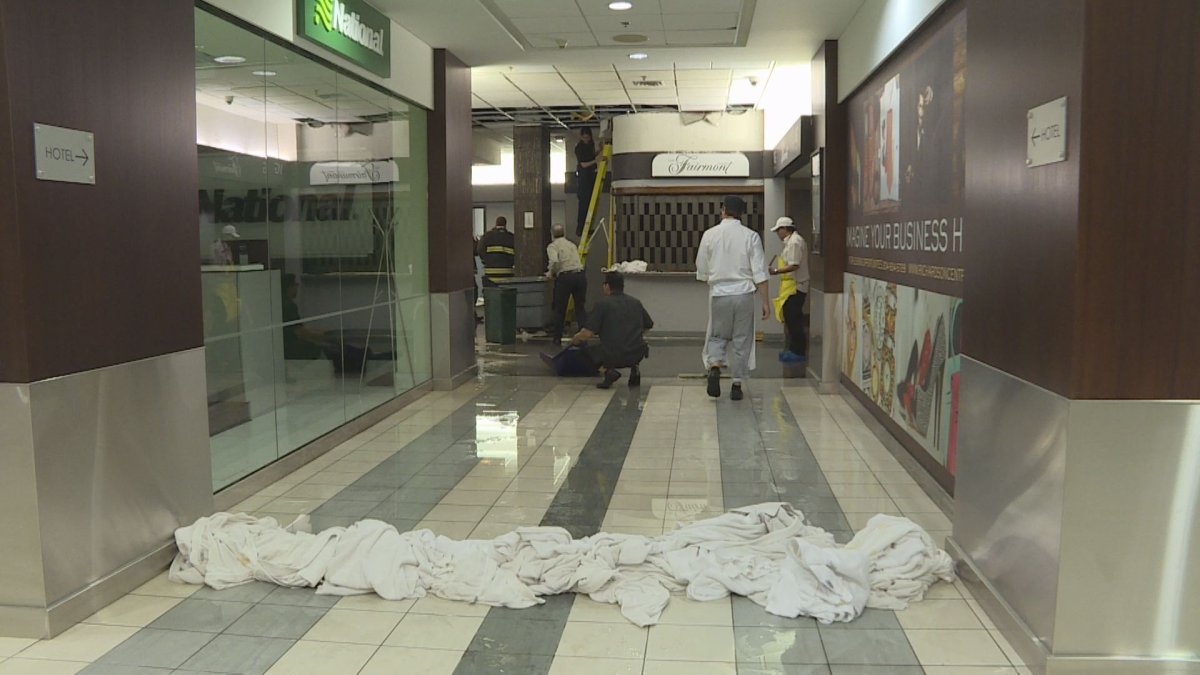 Water is mopped up in Winnipeg Square after water came pouring through the roof late Wednesday afternoon. 