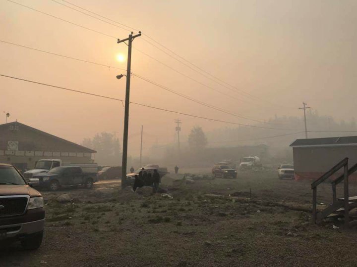Power restored to Manitoba communities hit by fires but evacuees still waiting to return