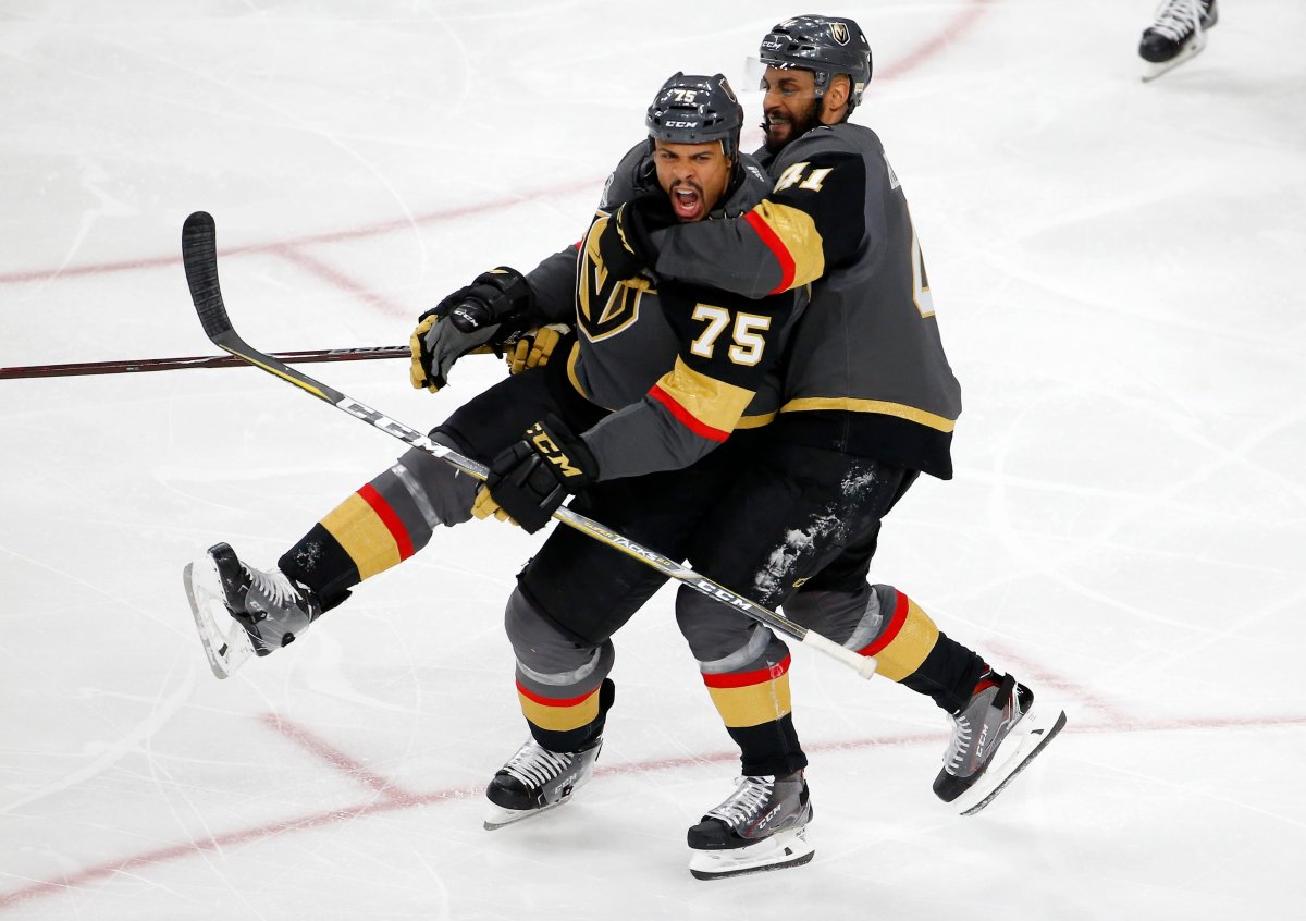 Vegas Golden Knights right wing Ryan Reaves, left, celebrates his goal with left wing Pierre-Edouard Bellemare, of France, during the third period in Game 1 of the NHL hockey Stanley Cup Finals against the Washington Capitals Monday, May 28, 2018, in Las Vegas.