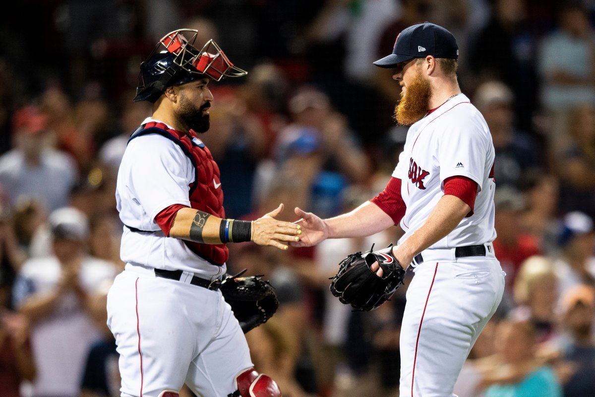 BOSTON, MA - MAY 29: Sandy Leon #3 of the Boston Red Sox high fives Craig Kimbrel #46 after recording the final out of a game against the Toronto Blue Jays on May 29, 2018 at Fenway Park in Boston, Massachusetts. 