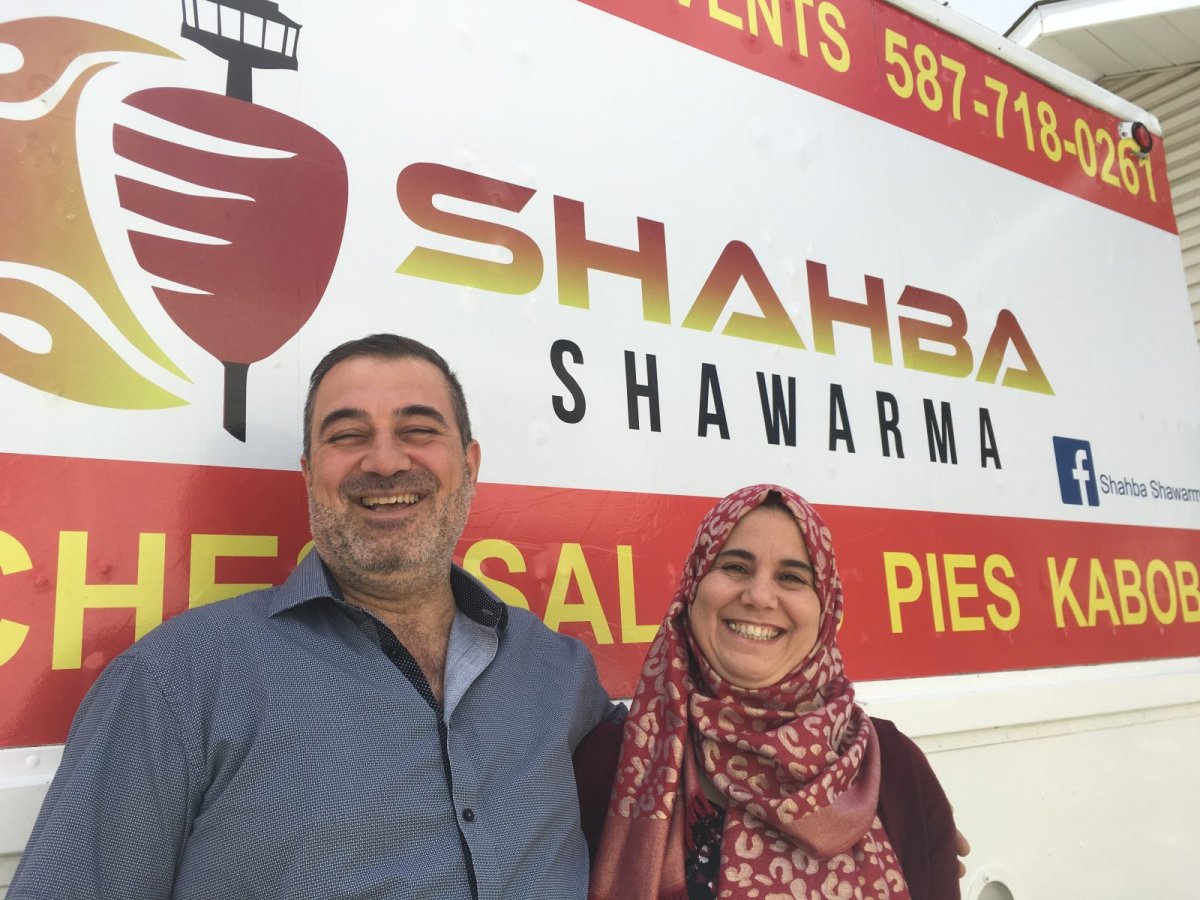 Owners Adel and Hiyam Ghanam stand in front of their new food truck 'Shahba Shawarma'.