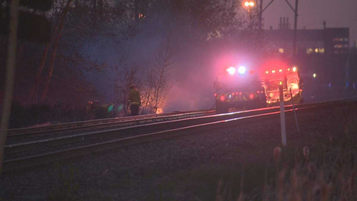 Grass fire along train tracks near 17 Street and 106 Avenue in Edmonton on May 9, 2018. 